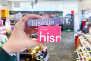 person holding 2 hismile teeth whitening products