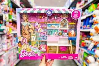 Barbie Pet Boutique Playset held up in center of toy isle at Walmart