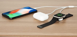 iphone airpods and apple watch on table with charger