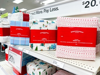 wondershop holiday flannel sheet sets sitting on a target shelf