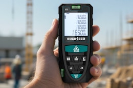 Person holding the RockSeed Laser Measure in hand.