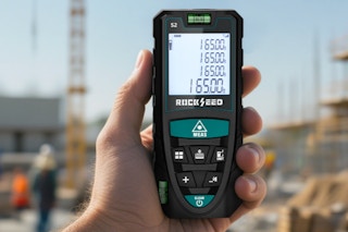 Person holding the RockSeed Laser Measure in hand.