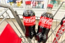 2 coca-cola bottles in a cart