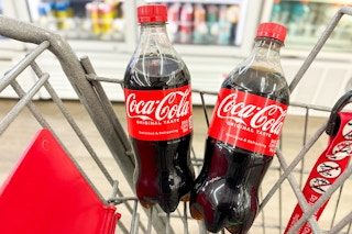 2 coca-cola bottles in a cart