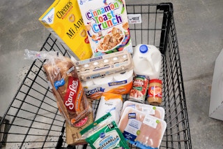 grocery essentials and pantry staples in cart at kroger