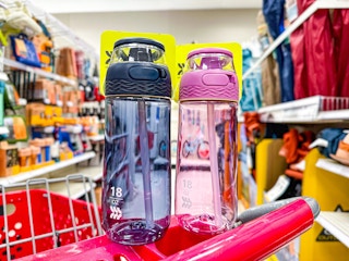 two all in motion flip top open tritan bottles on top of a target cart