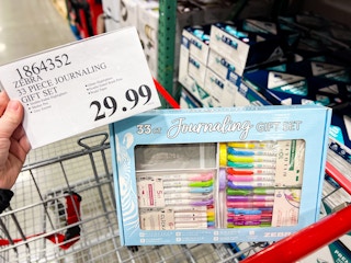 person holding a $29.99 price tag by a journaling gift set