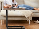 a small table in front of a person on a couch 