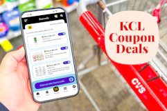 hand holding a smartphone displaying KCL Coupons next to a cvs shopping cart