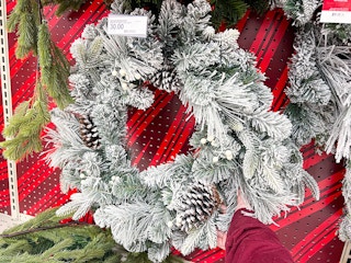 holiday wreaths sitting on a target shelf
