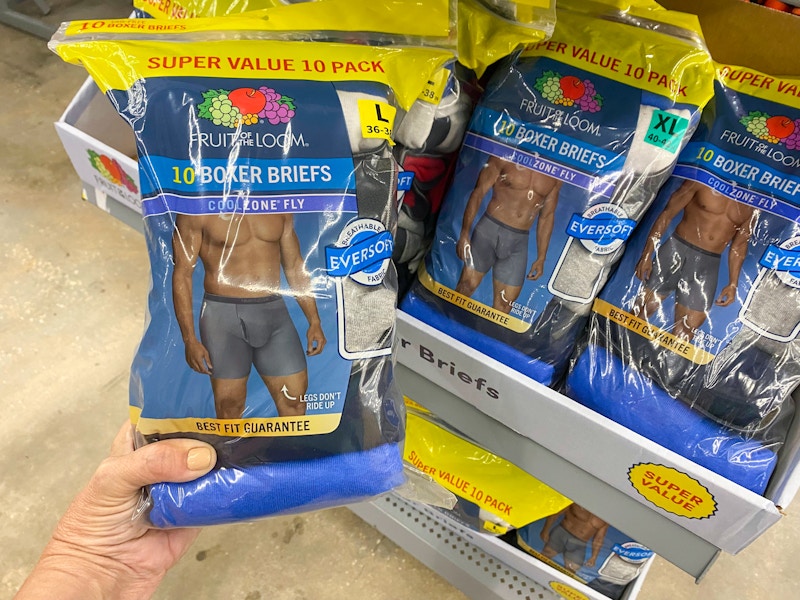 hand holding a super value pack of fruit of the loom boxers at walmart