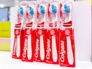 5 colgate 360 whitening toothbrushes sitting on a target table