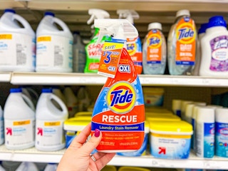 hand holding a tide laundry stain remover at target