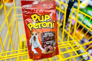pup-peroni dog treats in a yellow shopping cart