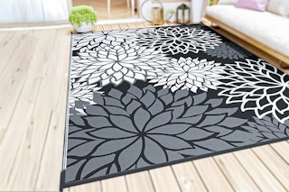 Lifestyle image of SIXHOME Outdoor Area Rug on deck