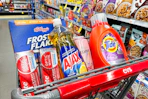 colgate toothpaste, ajax dish soap, frosted flakes cereal, tide detergent, and loreal elvive shampoo in a cart