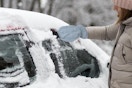 a woman scraping ice