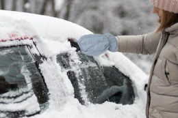 a woman scraping ice