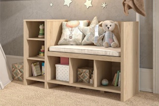 lifestyle image of a wooden storage bench in a child's room