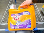 Arm & Hammer (Oxi Clean) laundry detergent (160 loads) held over Walmart shopping cart