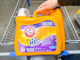 Arm & Hammer (Oxi Clean) laundry detergent (160 loads) held over Walmart shopping cart