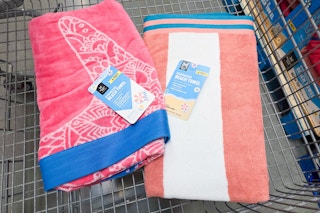 2 oversized beach towels in a cart
