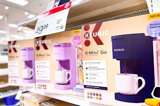 keurig k-mini coffee maker sitting on a target shelf