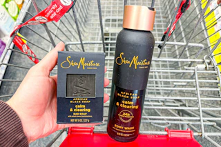 person holding a sheamoisture bar soap next to a body wash in a cart
