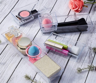 clear organizer trays with makeup products