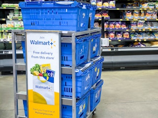 walmart plus sign in store on employee basket advertising free delivery and free trial of Walmart plus