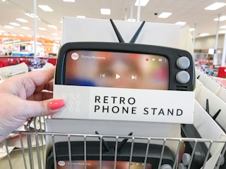 hand holding up retro phone stand box at Target