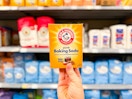 Arm & Hammer Baking Soda held up in baking aisle at Walmart