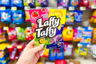 hand holding a bag of laffy taffy candy at dollar general