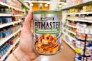 hand holding a can of progresso pitmaster soup