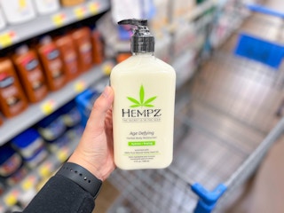 hand holding hempz age defying lotion at walmart