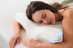 a woman using a neck pillow