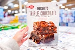 hand holding a box of betty crocker hersheys brownie mix