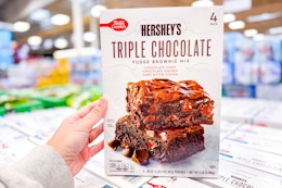 hand holding a box of betty crocker hersheys brownie mix