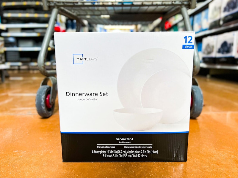 mainstays dinnerware set on walmart floor next to cart