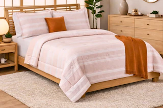 Lifestyle image of a Mainstays 5-piece comforter set with decor pillow in room setting