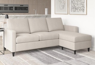 a cream colored sectional sofa