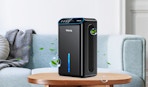 a dehumidifier on a table in front of a couch