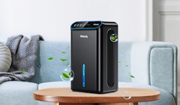 a dehumidifier on a table in front of a couch