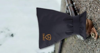 a faucet cover over an outdoor faucet