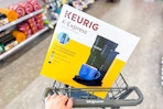keurig k-express coffee maker in a cart