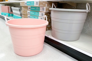 a tub sitting on the floor in front of another tub on a target shelf