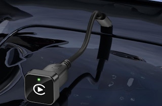 a wireless CarPlay plugged into a car 