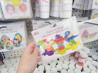 hand holding a pack of cupcake wraps