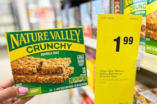 hand holding box of Nature Valley Crunchy bars next to sales tag