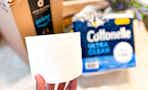 Cottonelle toilet paper being held in front of prime box